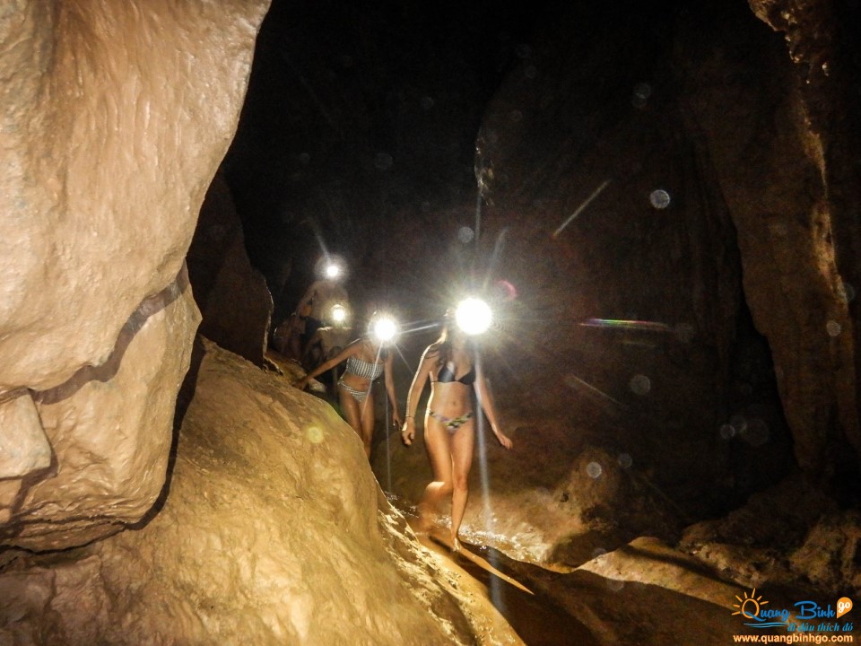 Dark cave entrance mud bath Phong Nha Ke Bang